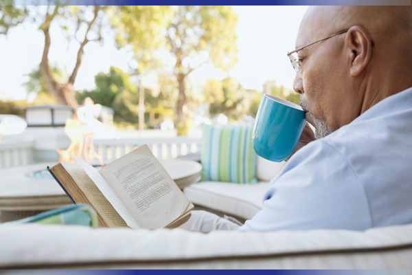 Elderly man drinking coffee from a mug