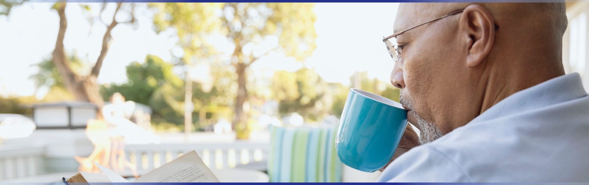 Elderly man drinking coffee from a mug