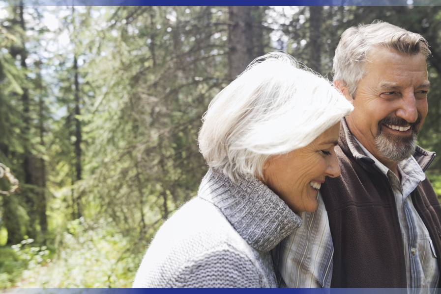 Elderly man and woman walking together